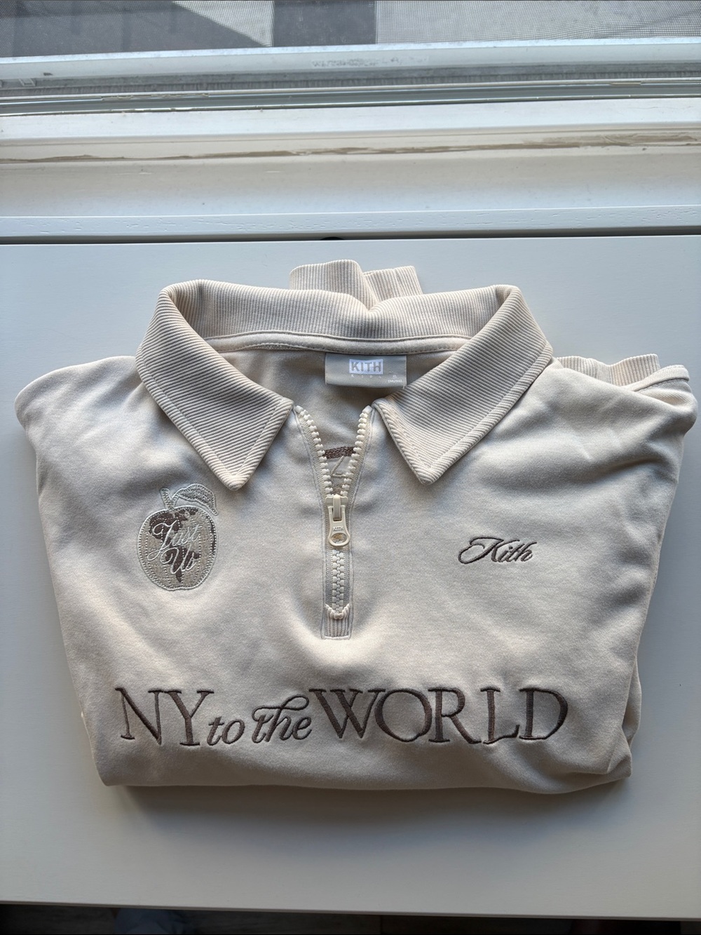 Kith Cream Half-Zip Polo with ‘NY to the WORLD’ Embroidery
